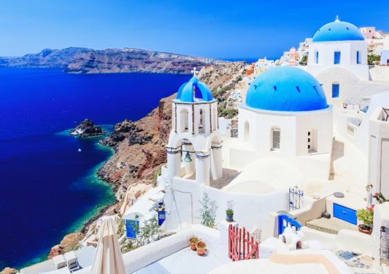 Blue-domed church and sea view in Santorini, Greece