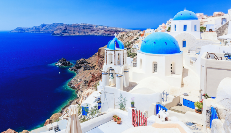 Blue-domed church and sea view in Santorini, Greece