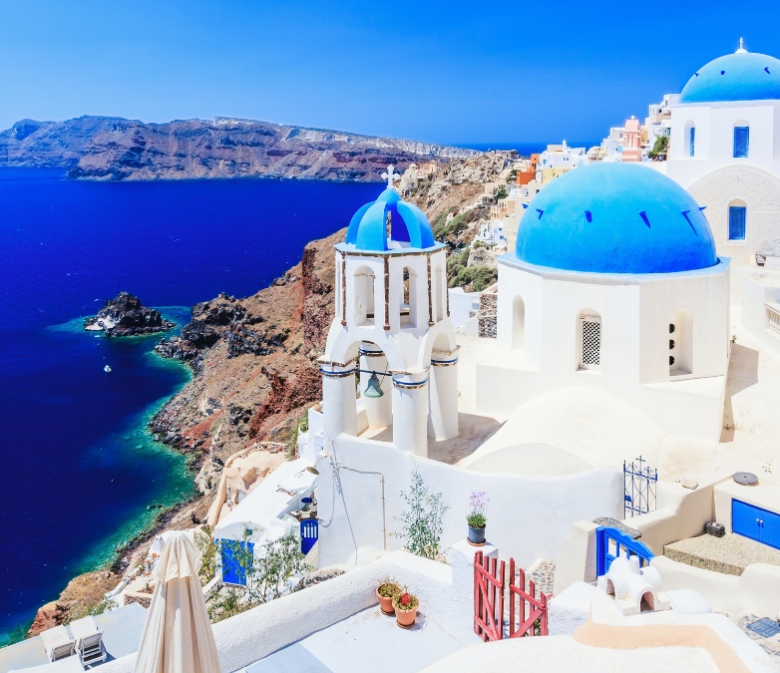 Blue-domed church and sea view in Santorini, Greece